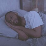 fotosearchmannotsleeping