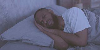 fotosearchmannotsleeping