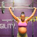 Jane Kabogo performs an overhead barbell press at the Kaizen gym.