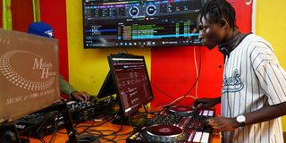 A DJ student training on professional Pioneer gear at Melody House, the best DJ school in Nairobi Kenya. 